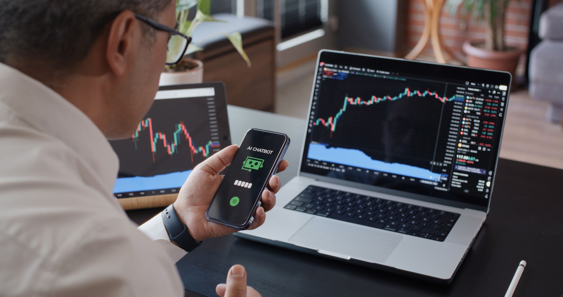 Man using AI Chatbot while checking his stock market exchange investment with TradingView on laptop computer